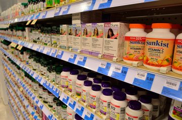 A picture of dietary supplements on a store shelf.